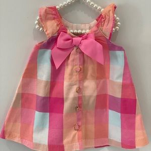 Colourful summer dress w/ bright pink bow in back